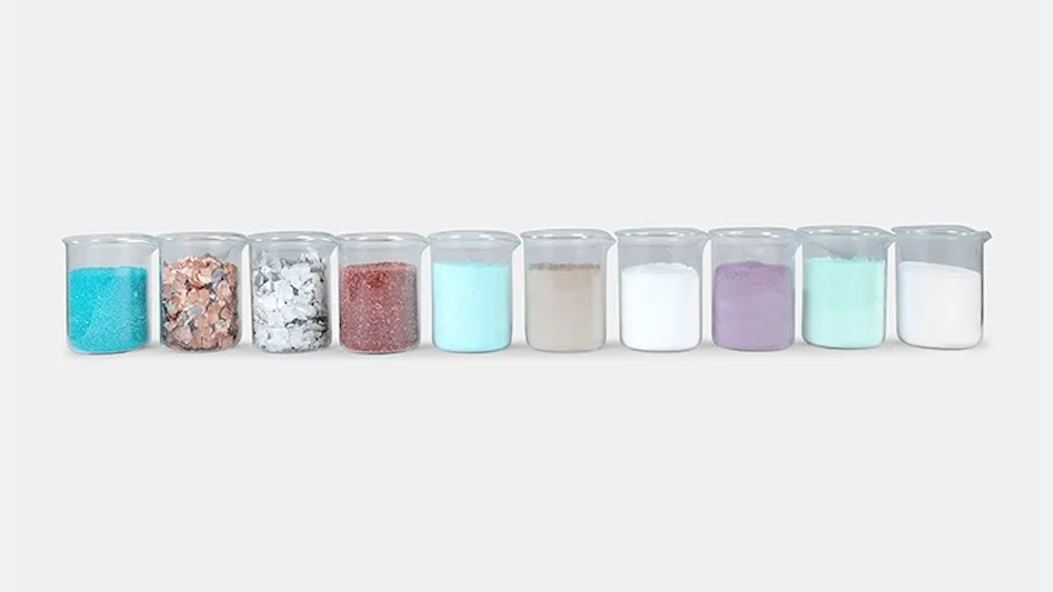beakers of materials recovered from batteries