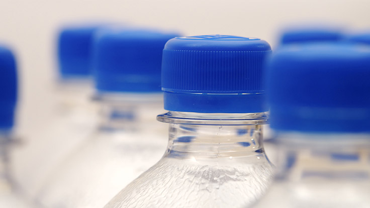 Weight of water bottles decreases, while recycled content increases