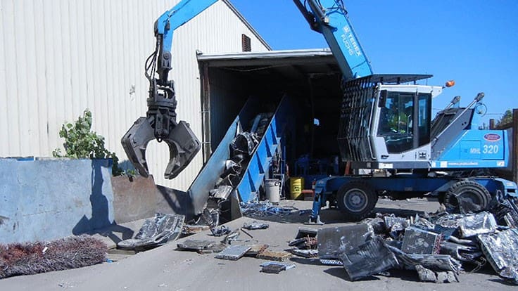 conveyor scrap pile material handler