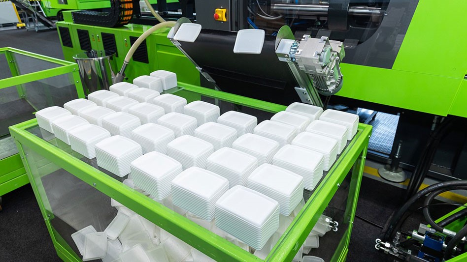 a green machine manufacturing plastic containers