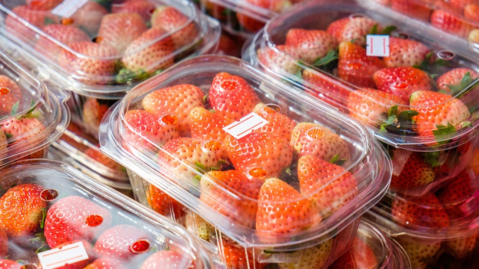 plastic containers of strawberries stacked up