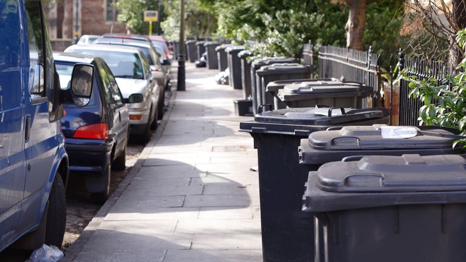 parked cars and roadside waste and recycling collection bins