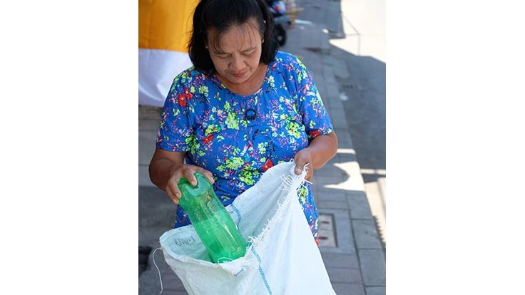  Nyoman Darti collects plastic waste in the new recycling center opened by SC Johnson and Plastic Bank in Bali, Indonesia.