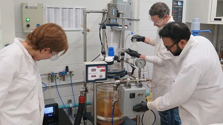 scientists in test lab