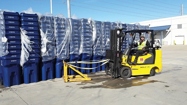 Carts being moved onto delivery truck