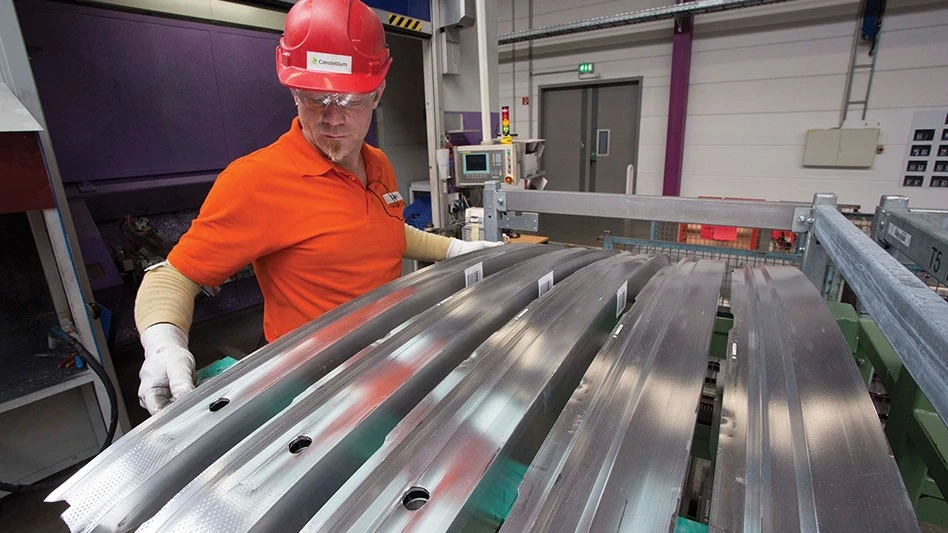 man with aluminum extrusions