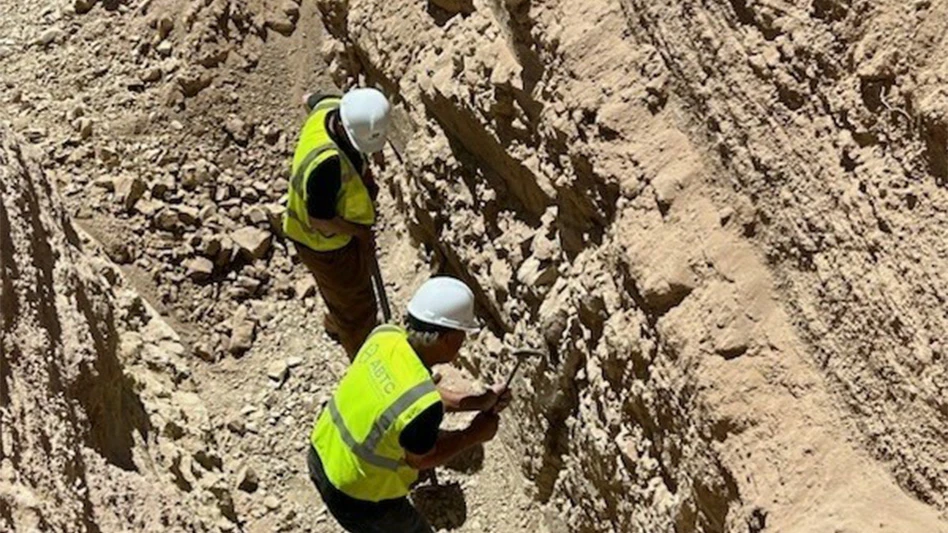 ABTC team collecting large-scale samples of its lithium bearing claystone material for processing.