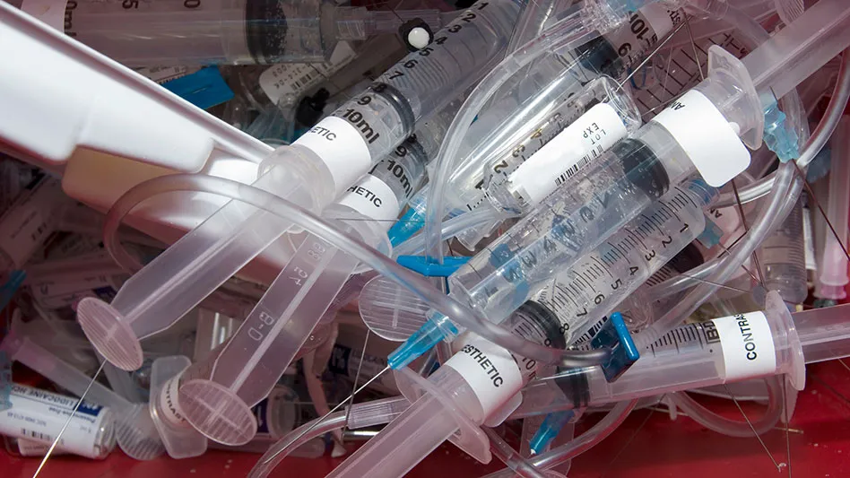 Medical waste syringes in a pile