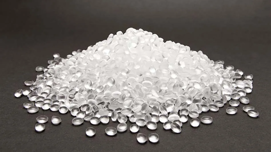 clear plastic pellets in a pile on a black background