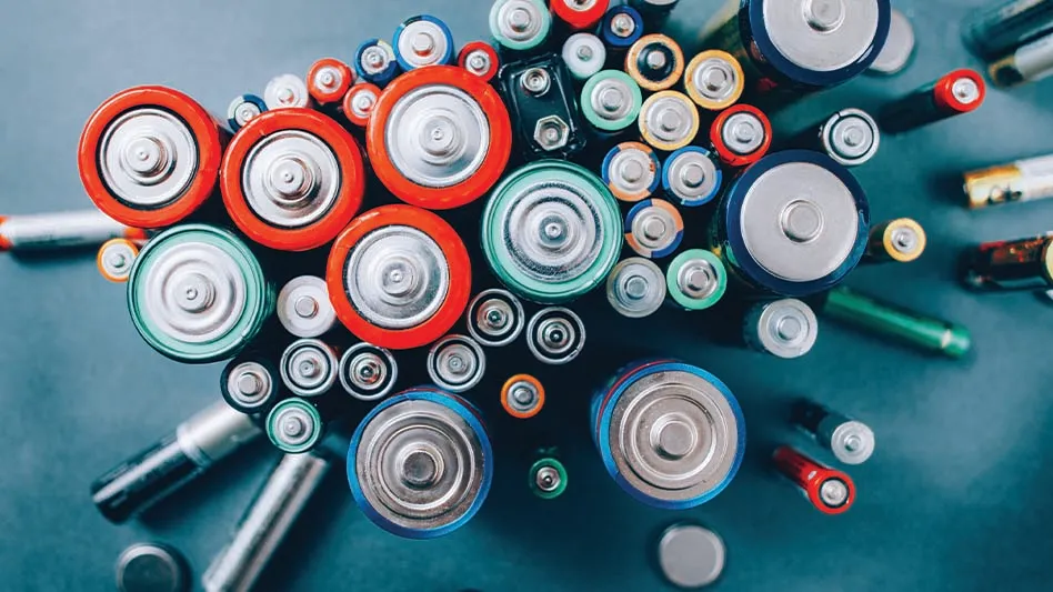 An overhead view of an assortment of various types of batteries.