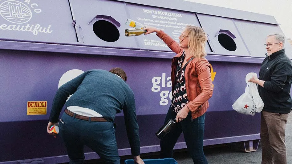 Residents placing glass bottles in purple recycling bin