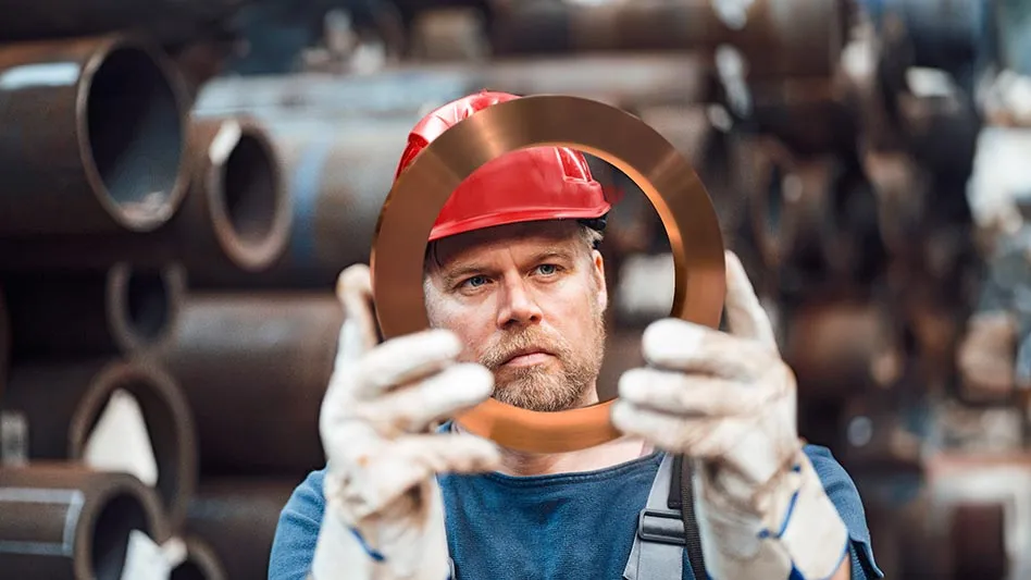 worker handling copper