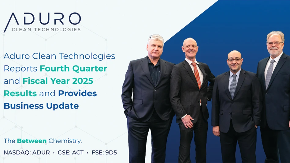 A group of businessmen pose together for a photo.