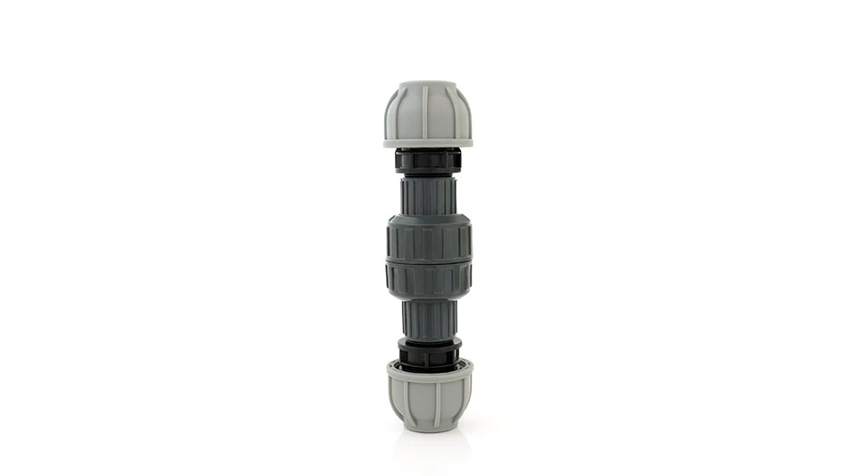 Plastic non return value compression fitting used in plumbing to facilitate the flow of liquid in one direction only, on white background.