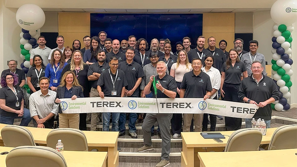 group of people smiling for ribbon-cutting ceremony