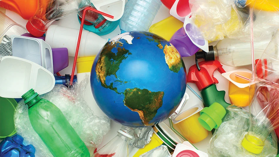 A globe surrounded by different types of plastic scrap on a white background.