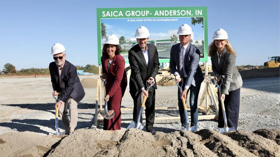 a group of people posing with shovels at a groundbreaking