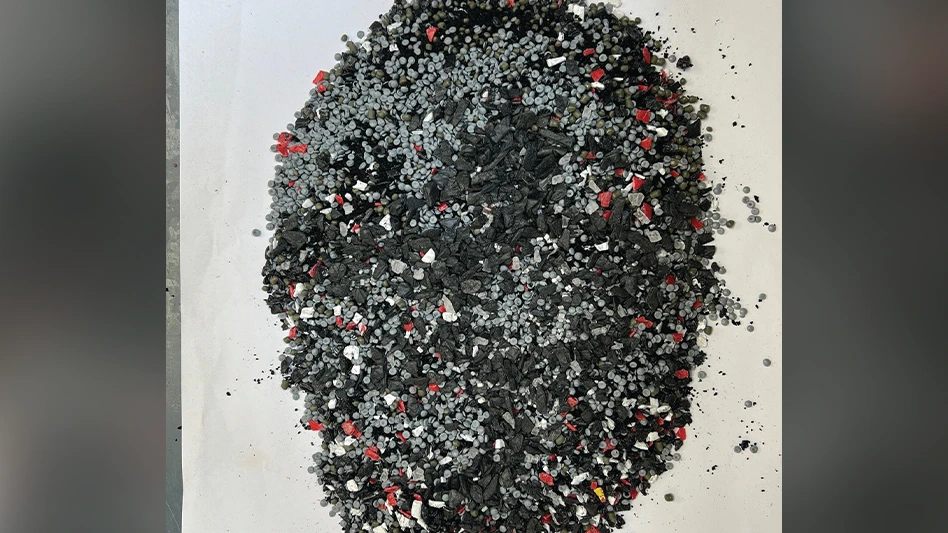 A pile of dark-colored plastic pellets.