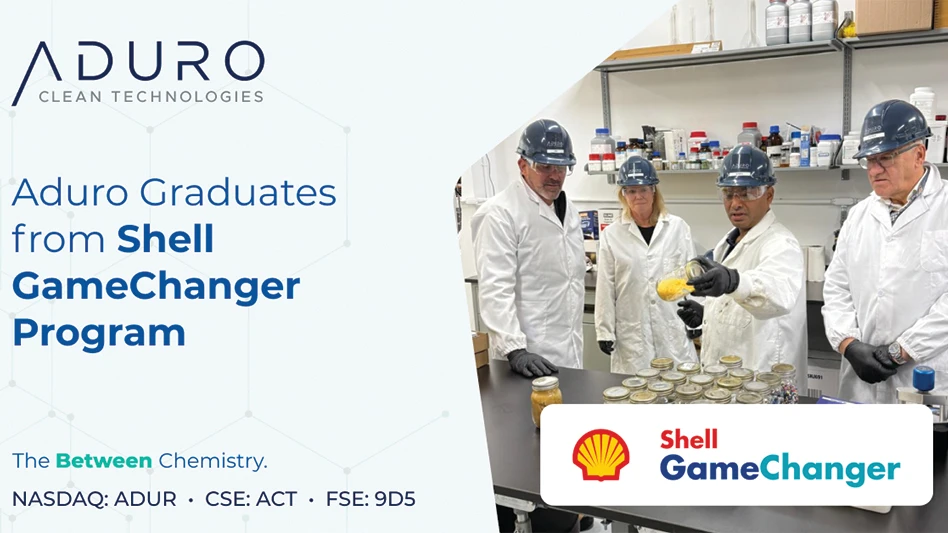 Four people in lab coats conduct a test.