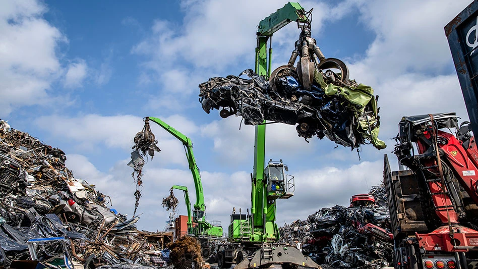 laoders holding cars and scrap metal