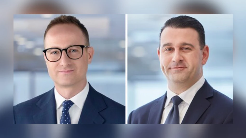 two men smiling at camera