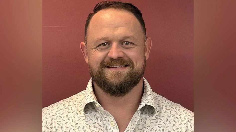 a bearded, smiling man