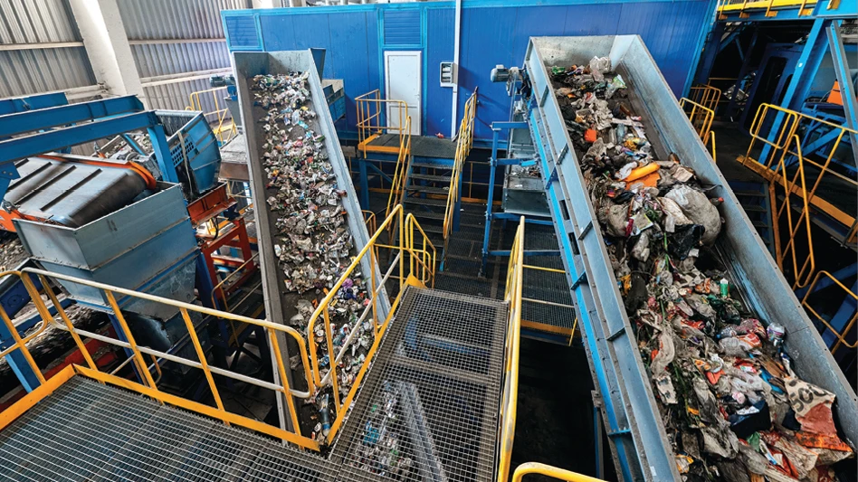 Recyclables move along conveyor belts inside a recycling facility.