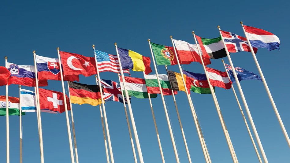 Various countries' flags wave in the air.