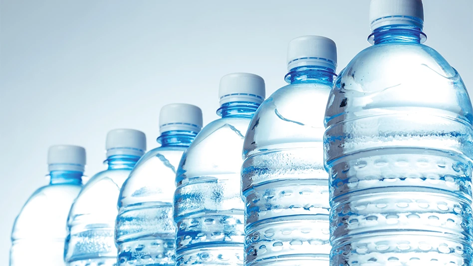 Six plastic water bottles lined up in a row.