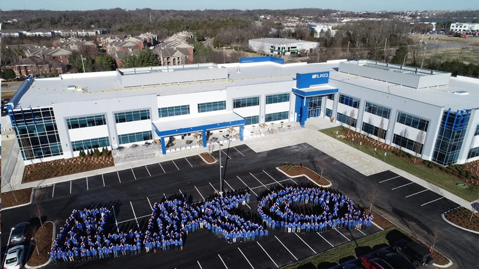 lkq employes recreate company logo outside office building
