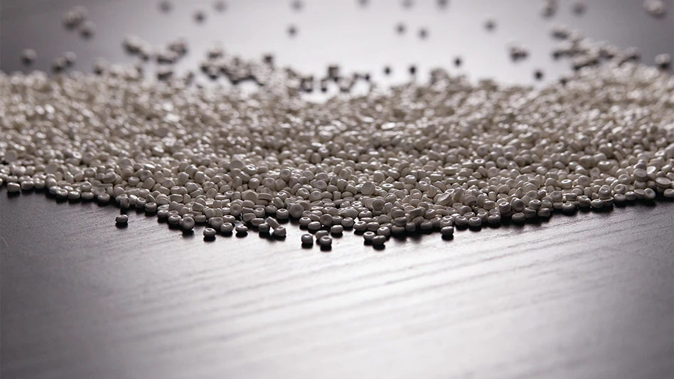 white plastic pellets spread out on a suface.