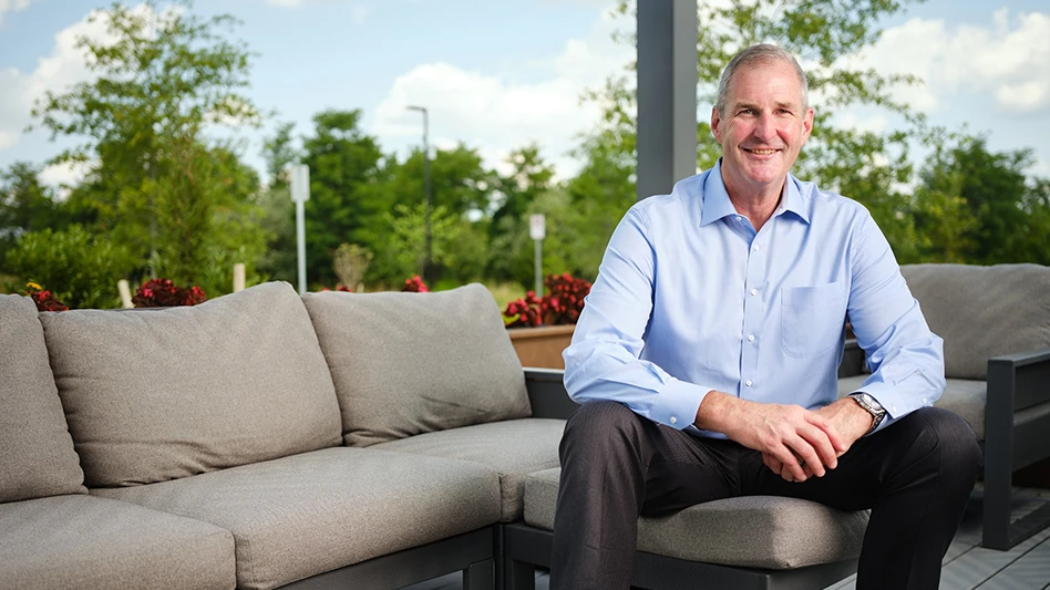 man in blue shirt smiling