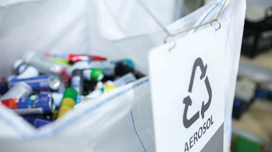 A container of aerosol cans destined for recycling.
