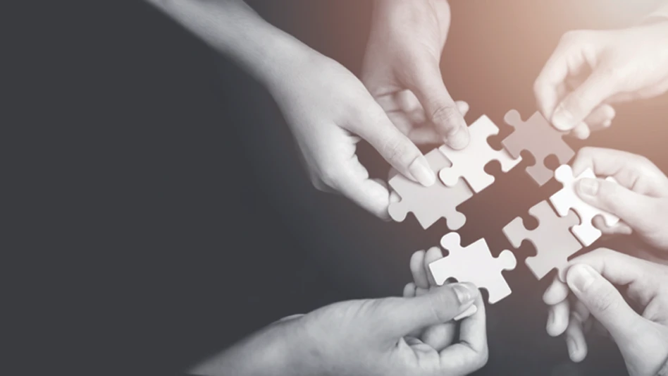 Hands holding puzzle pieces.