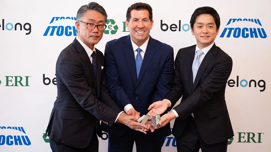 three men stand holding materials recovered from electronics